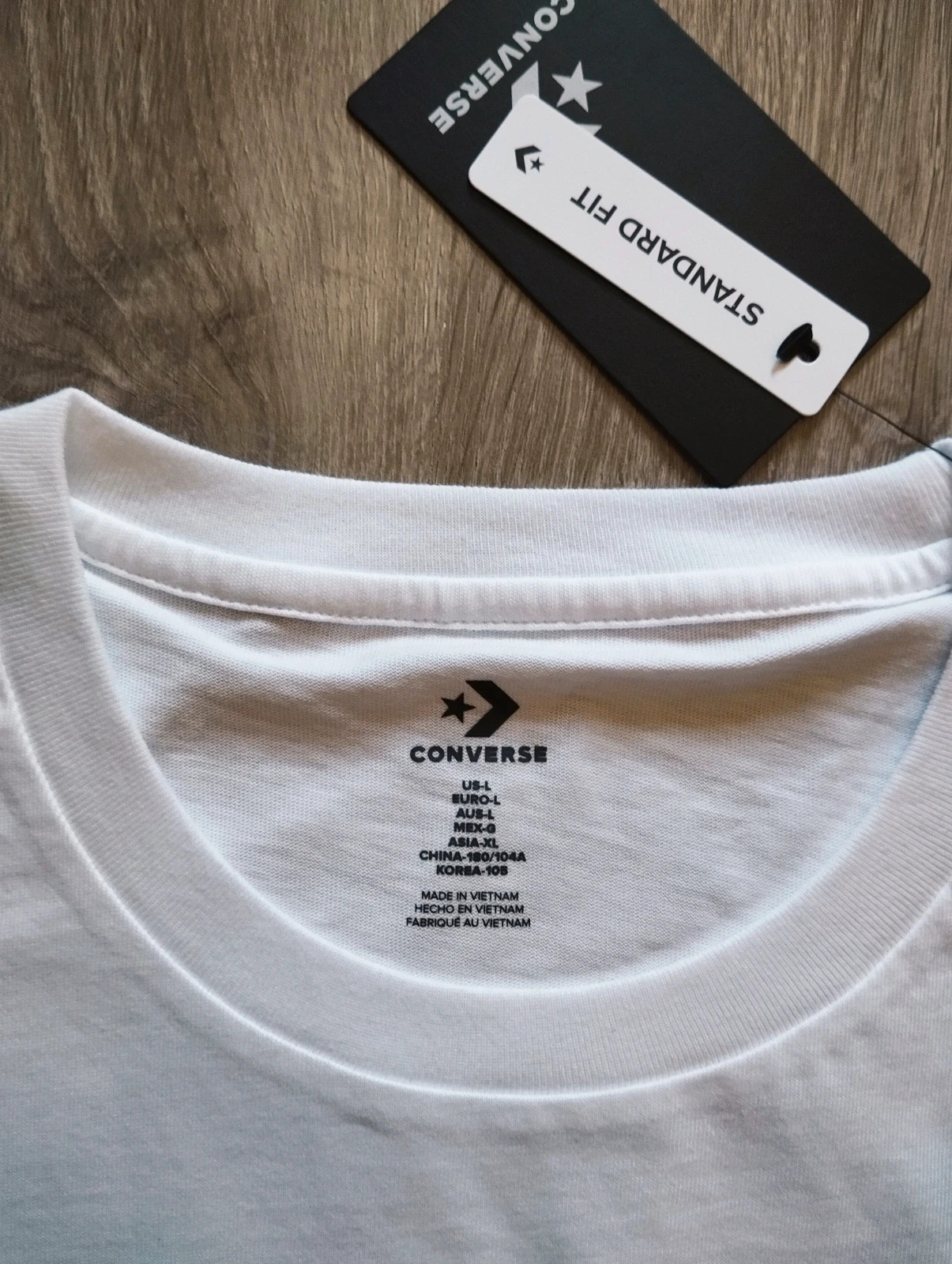 White Converse All Star T-shirt with black text and star graphic 2