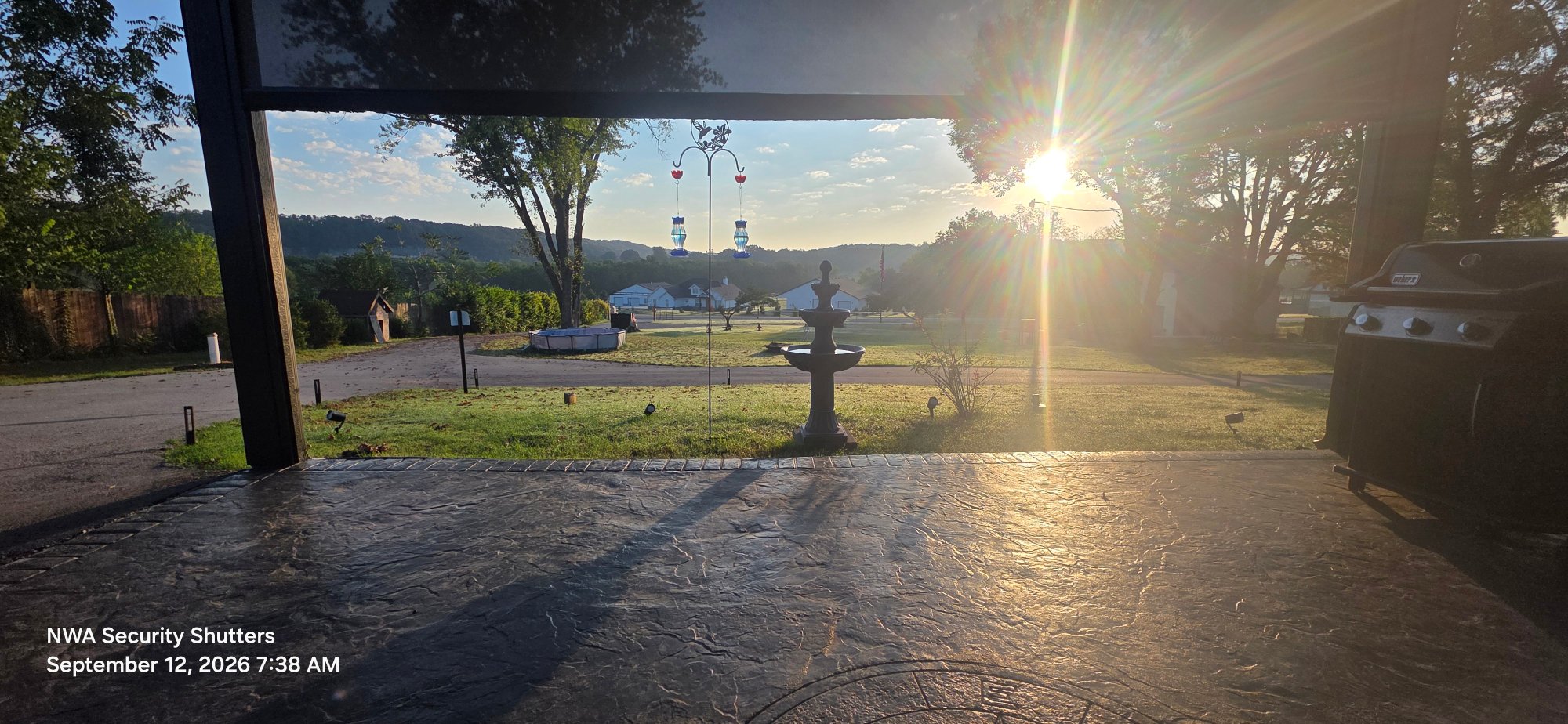 Sun coming up over the Springdale patio with the screen down. That is full privacy with the sun handled.