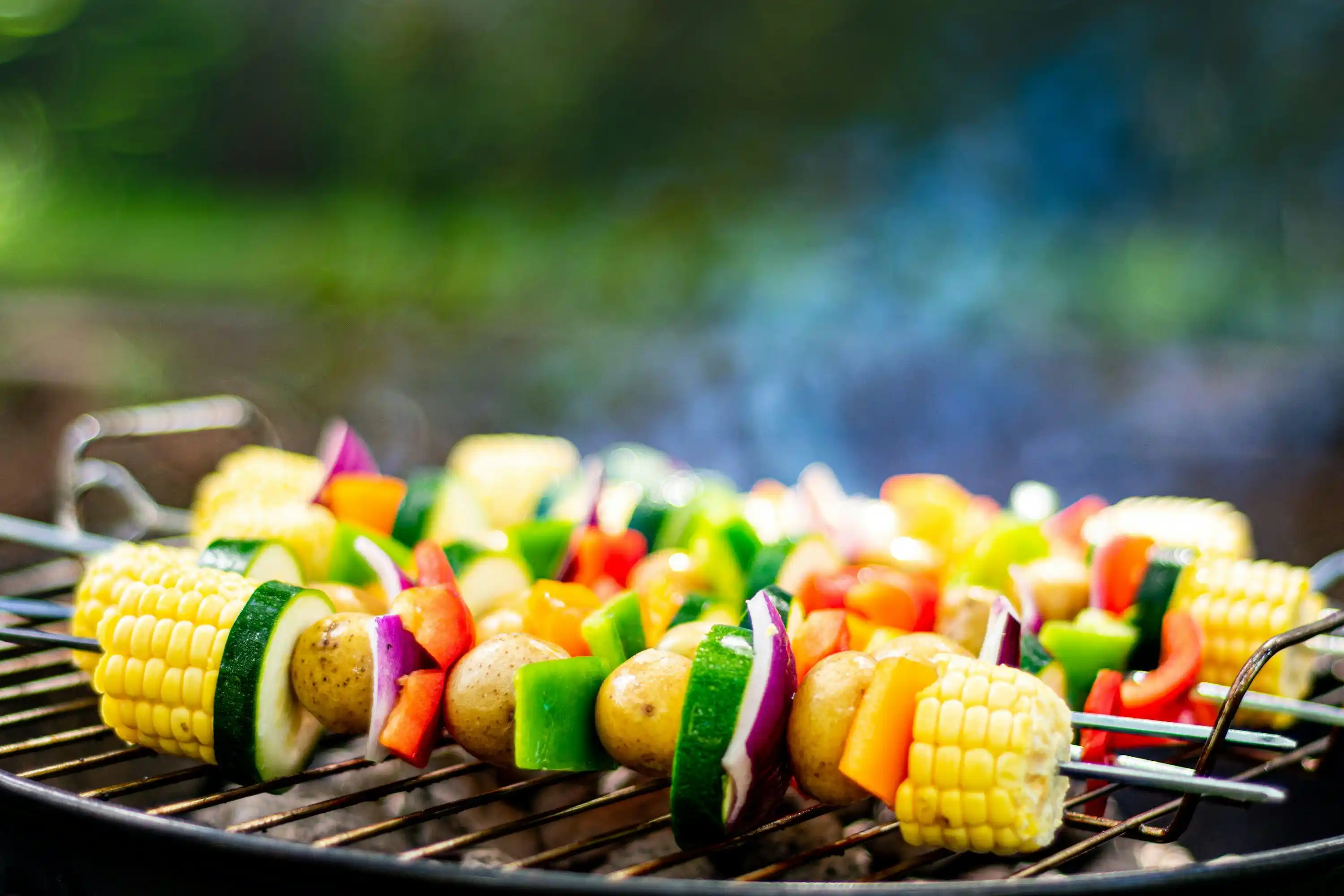 Fresh vegetables grilling over hardwood lump charcoal