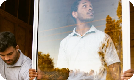 Workers installing window