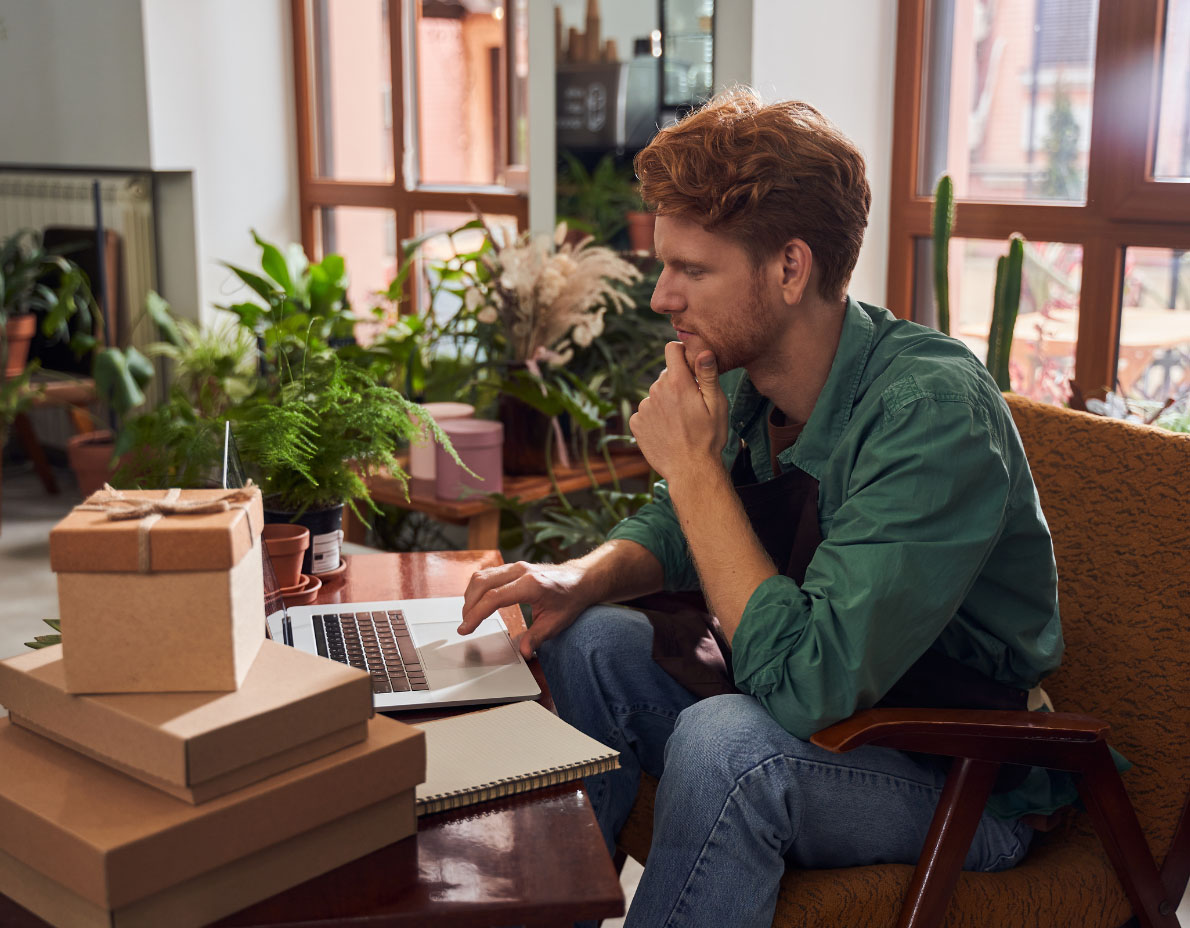 Owner managing orders on a laptop