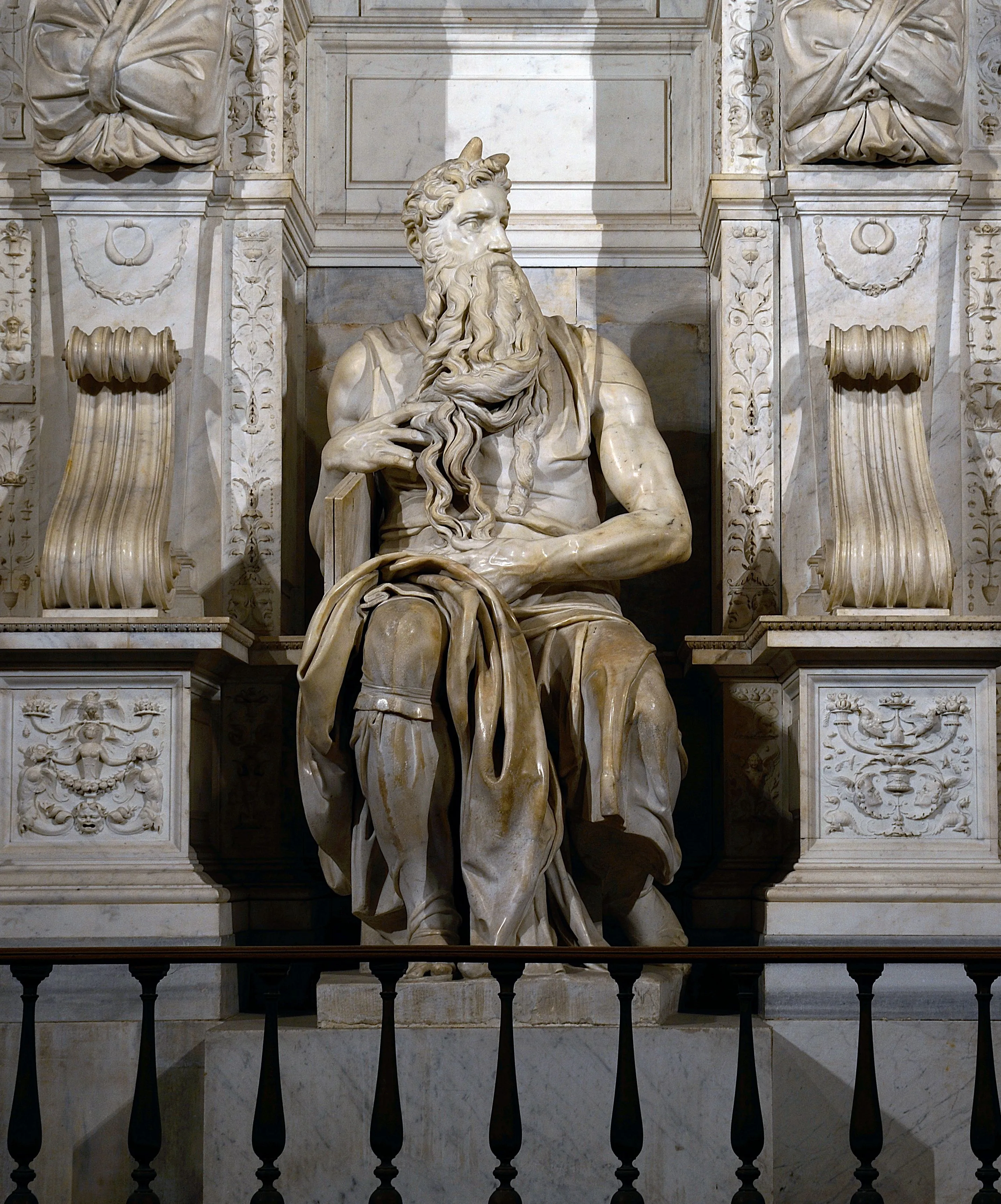 This image features Michelangelo's Moses sculpture, demonstrating excellent composition, sharpness, and photo-realism. The lighting effectively highlights the intricate details of the marble, and the key elements are precisely in focus. There are no unwanted elements such as text, watermarks, or promotional graphics.