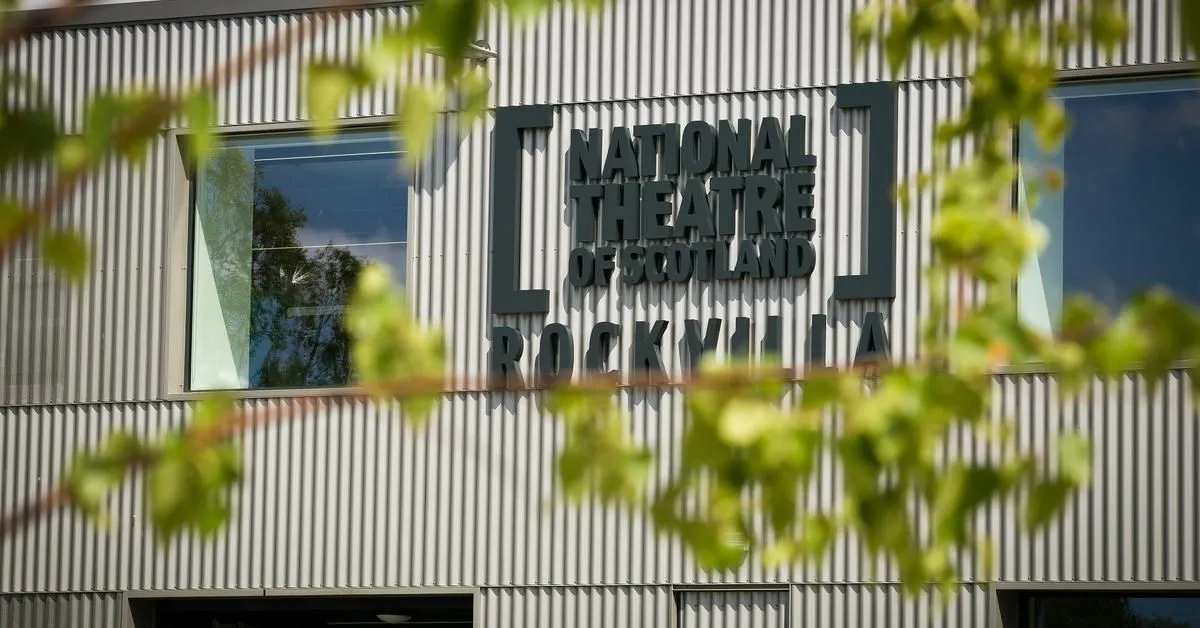 An editorial quality image of the National Theatre of Scotland's Rockvilla building, showcasing its exterior and prominent signage.