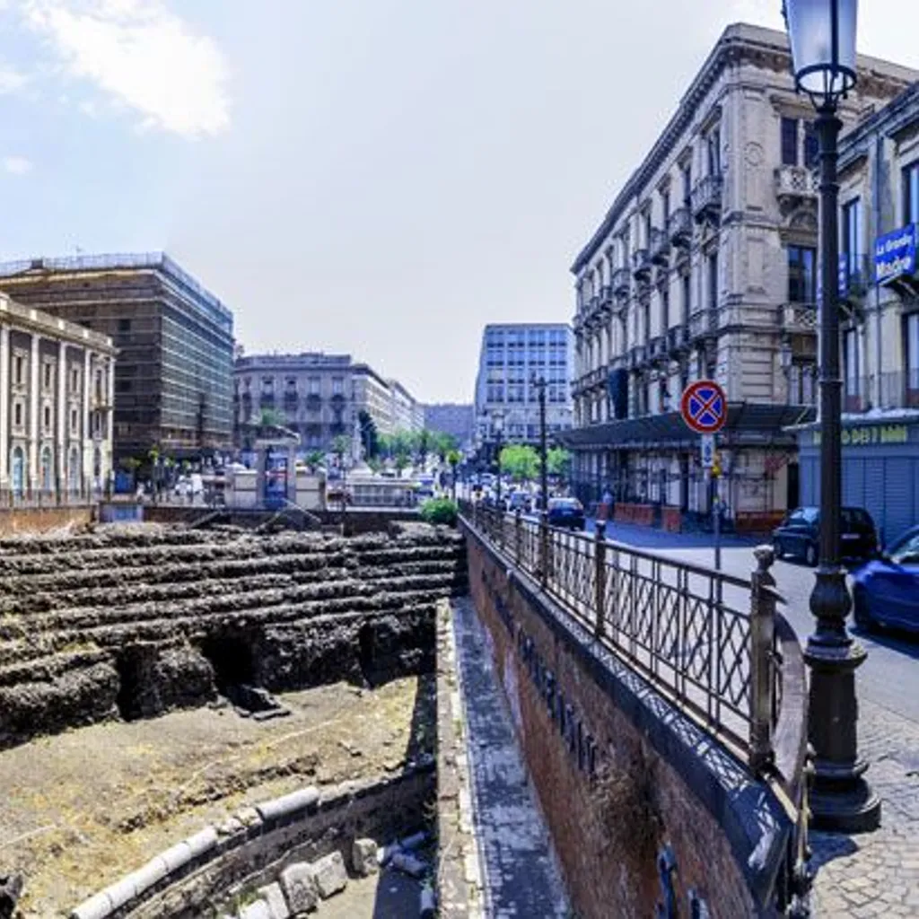 A well-composed image capturing the ancient Roman theater ruins and historic buildings under natural daylight.