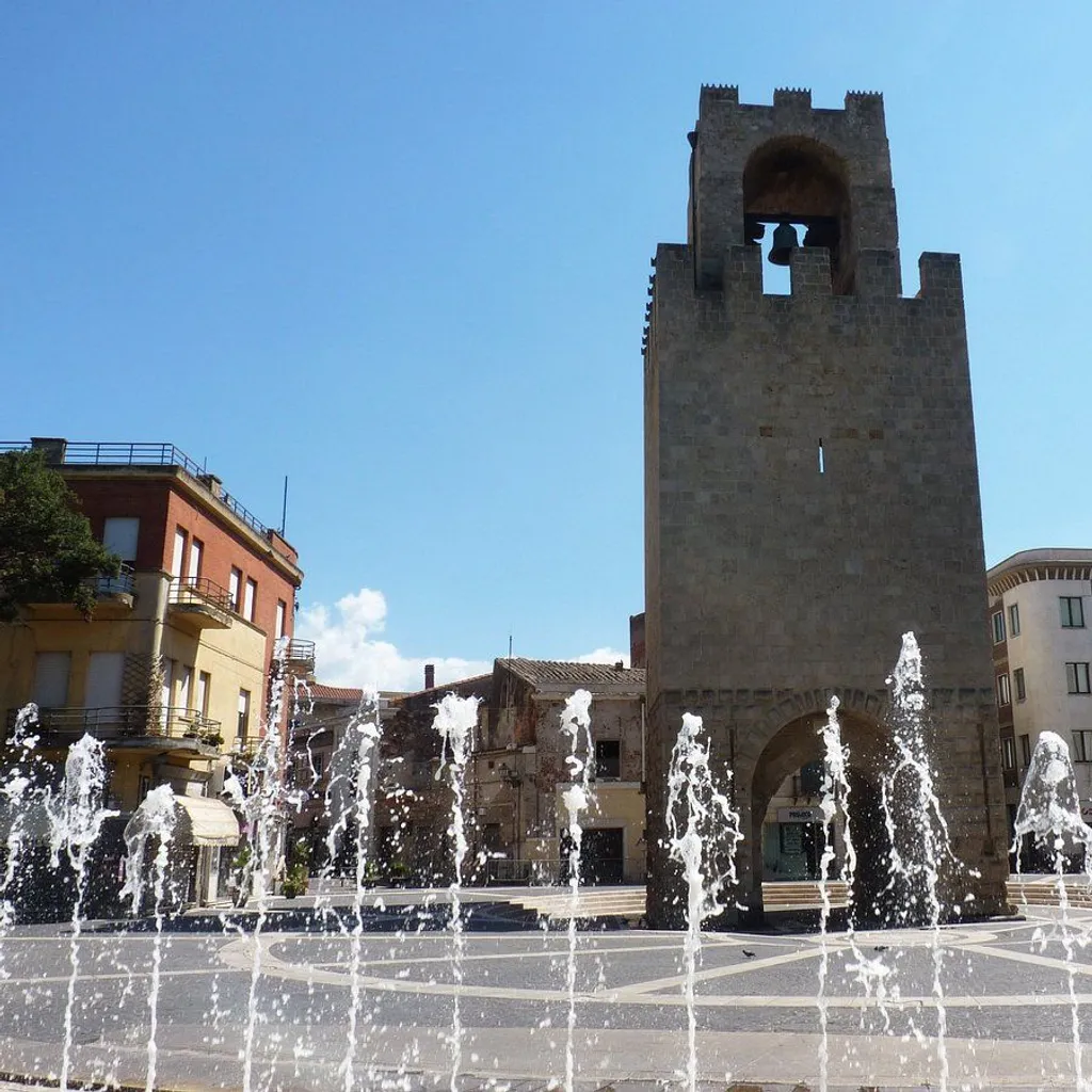 An editorial style image showcasing a historical bell tower and a fountain in a bright, sunny urban square.