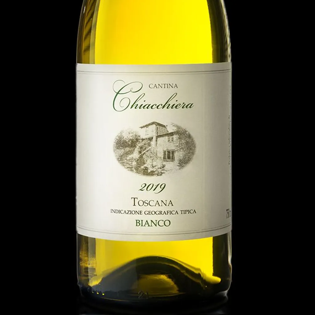 A high-quality studio photograph of a white wine bottle, with its label prominently displayed, set against a plain black background. The lighting effectively showcases the bottle's form and the liquid's color.