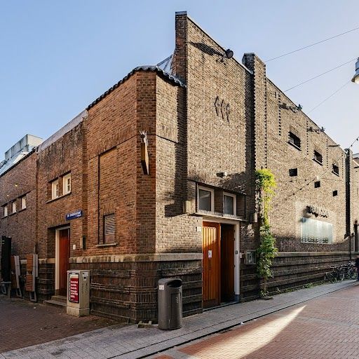 The image is of a building's facade. It is well-composed and the colors are accurate. The lighting is a bit flat, but the details of the building are still visible. The image is sharp and there are no unwanted elements. The category of the image is 'exterior'.