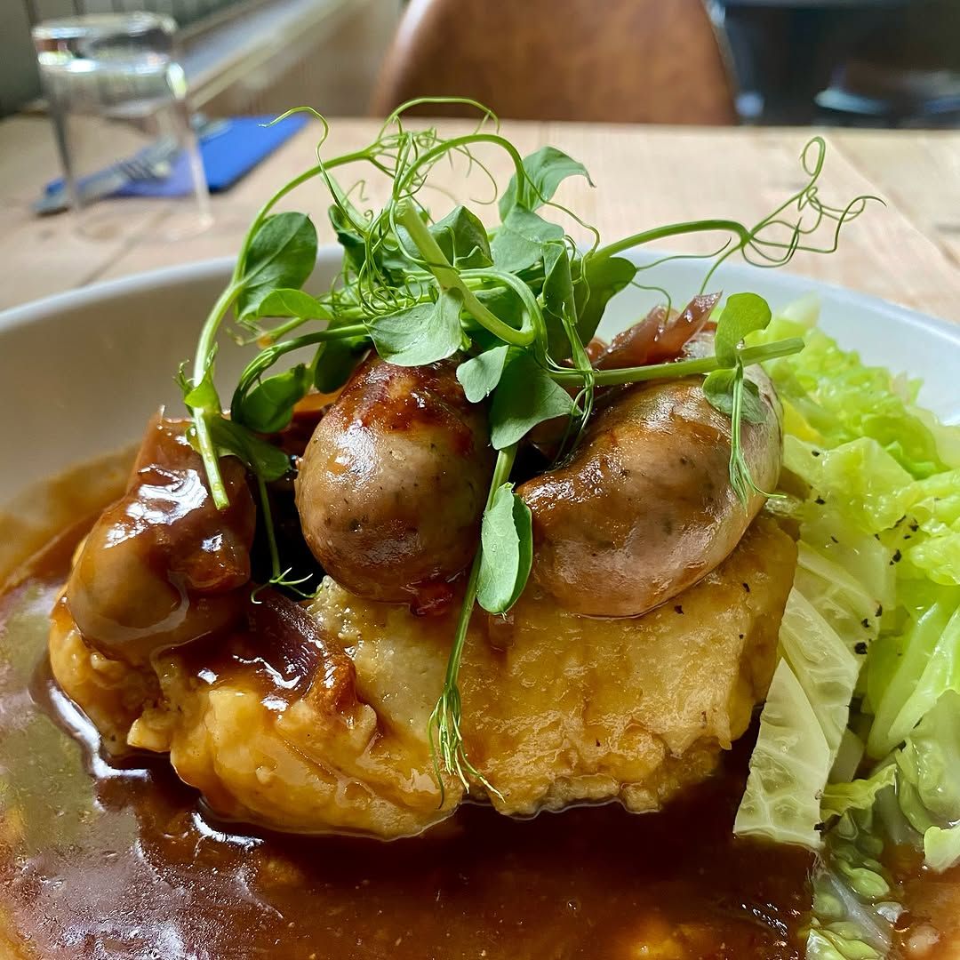 This is a professionally taken close-up image of a restaurant dish. The composition is excellent, highlighting the key elements of the dish. The lighting is well-balanced, ensuring the colors are accurate and vibrant. The image is sharp, with good detail visible throughout. The photo is highly photorealistic, making the food look appetizing. All key elements are in focus. No unwanted elements are present.
