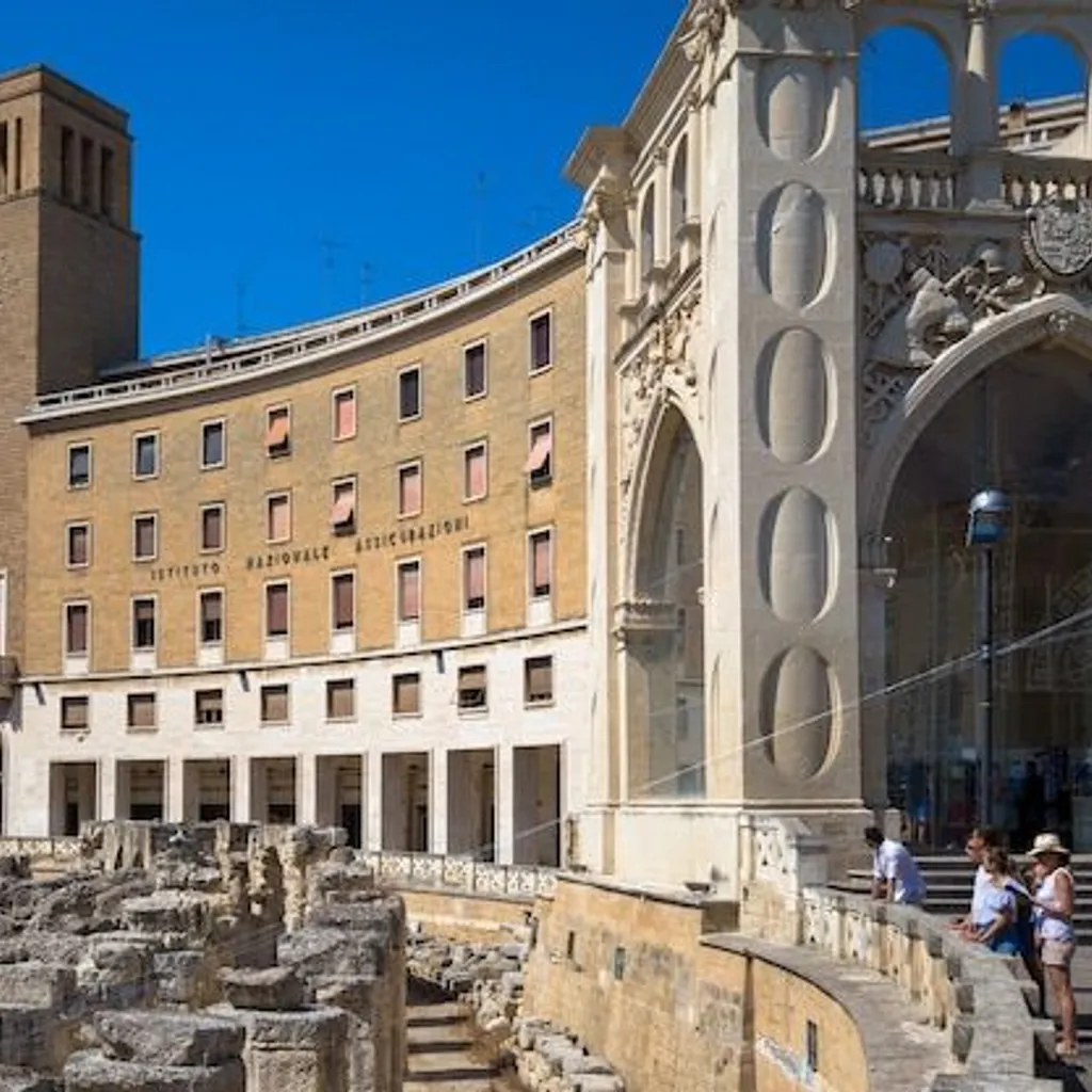 A vibrant outdoor shot showcasing a historical urban landscape featuring a modern-era curved building with a prominent tower, an adjacent ornate stone structure, and ancient ruins in the foreground under a clear blue sky.