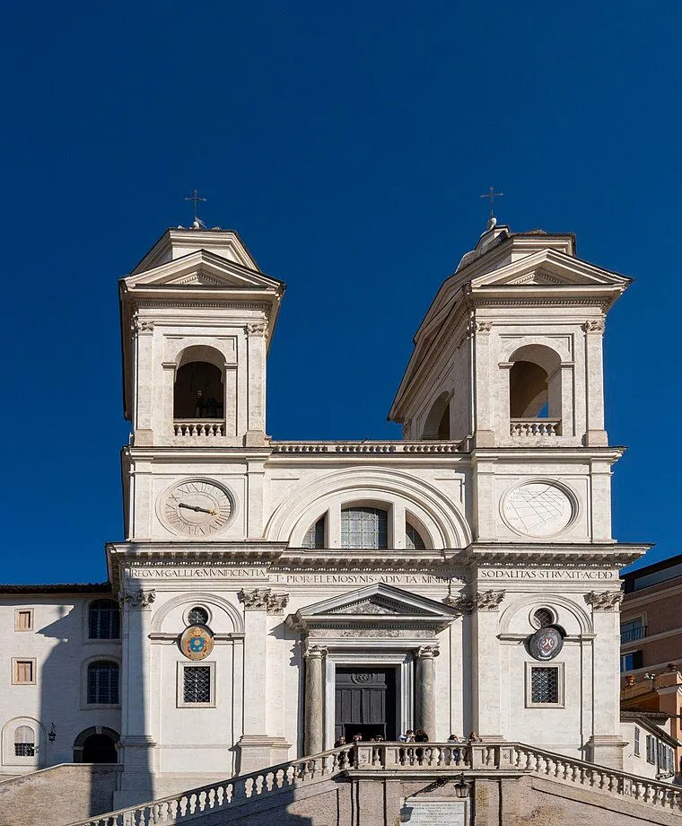 The image prominently features the Trinità dei Monti church facade against a vibrant blue sky. The composition is strong, centered on the building and capturing its detailed architecture. The lighting is excellent, illuminating the white stone and highlighting its textures and shadows effectively. The image is very sharp, with clear focus on all key architectural elements, contributing to its high photo-realism. Colors appear accurate and natural.