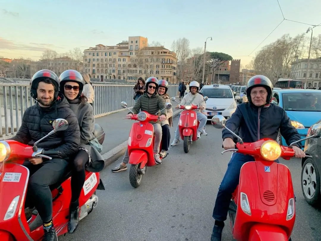 The image is photo-realistic with clear and in-focus key elements, including the people and their vibrant red scooters. The colors appear accurate and natural. While the composition effectively captures the group engaging in a travel activity, the overall lighting is somewhat flat, lacking strong dynamic range.