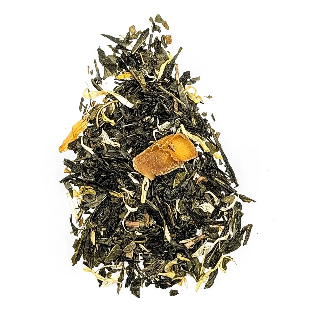 The image features a well-composed, sharply focused, and color-accurate depiction of loose-leaf tea with dried fruit and flower petals on a clean white background. The lighting is excellent, highlighting the natural textures and colors, making it highly photo-realistic. All key elements are in sharp focus.