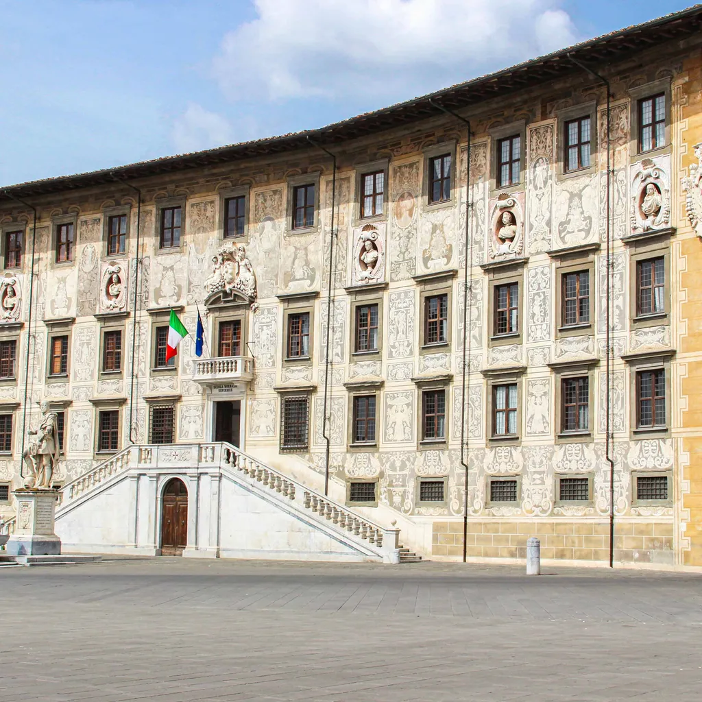 The image is well-composed, featuring a historic building prominently in the frame. Lighting is excellent and even, highlighting the intricate details of the facade. The image is sharp, color-accurate, and highly photo-realistic, with all key architectural elements in focus.