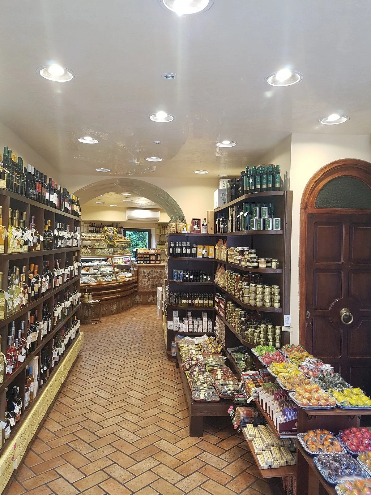 The image is generally sharp and photo-realistic, with most key elements in focus, offering a clear view of the store's interior and merchandise. The colors appear accurate. However, the lighting is a bit uneven, creating some bright spots on the ceiling and slight shadowing within the shelves. The composition is functional but lacks a strong artistic flair.