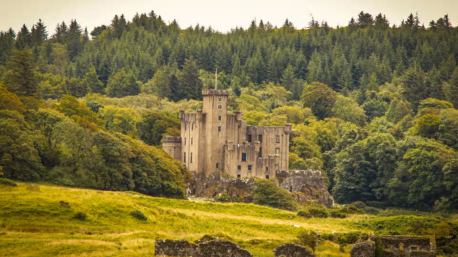 The image showcases a castle nestled within a forest landscape. The composition is well-balanced, with the castle as the primary subject. The lighting is adequate, providing sufficient illumination to the scene, though it could be improved to enhance the depth and contrast. The image is reasonably sharp, capturing the details of the castle and surrounding foliage. The colors appear accurate, representing the natural tones of the environment. The image has a photo-realistic quality, capturing the scene in a natural and believable manner. The key elements, such as the castle's architecture and the surrounding trees, are in focus, drawing the viewer's attention to the main subject. Overall, the image is well-executed, capturing the beauty of the castle and its natural surroundings.