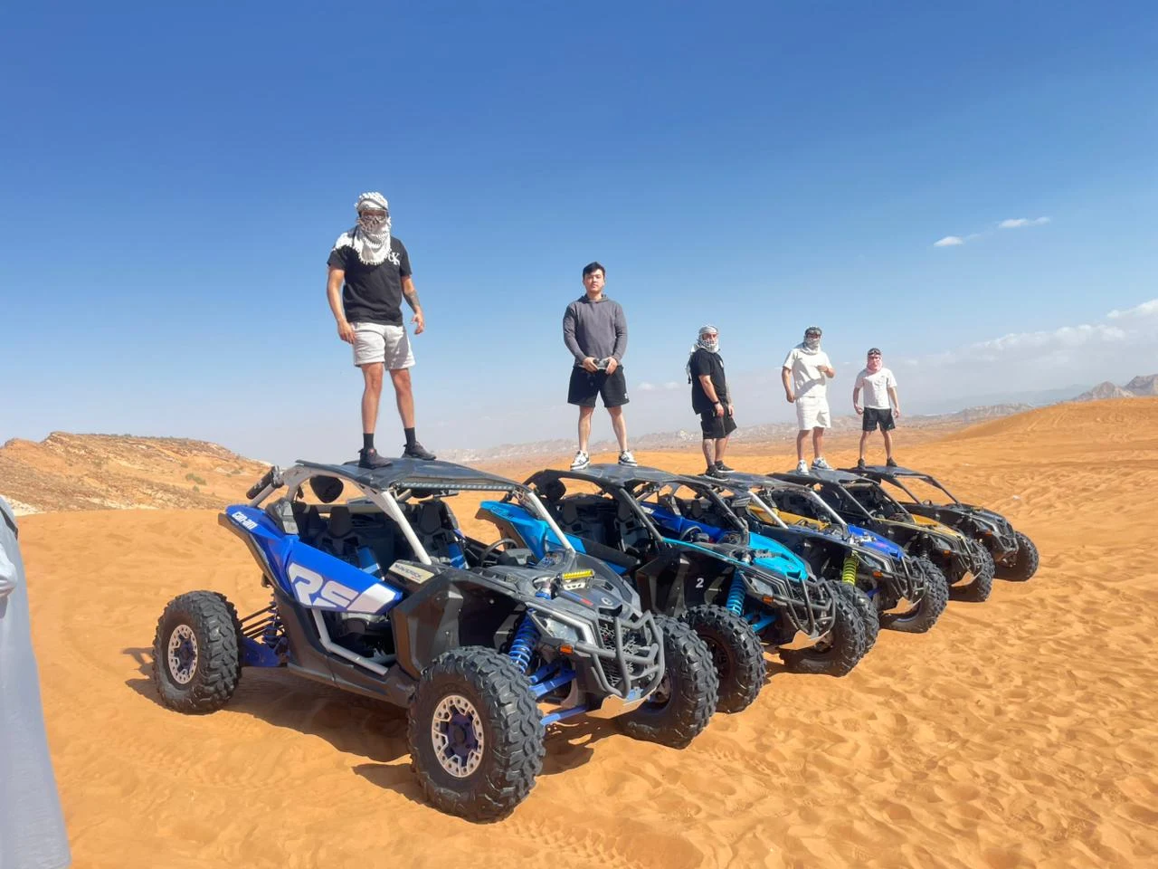 Can-Am maverick and Polaris RZR adventure across Dubai red sand desert.