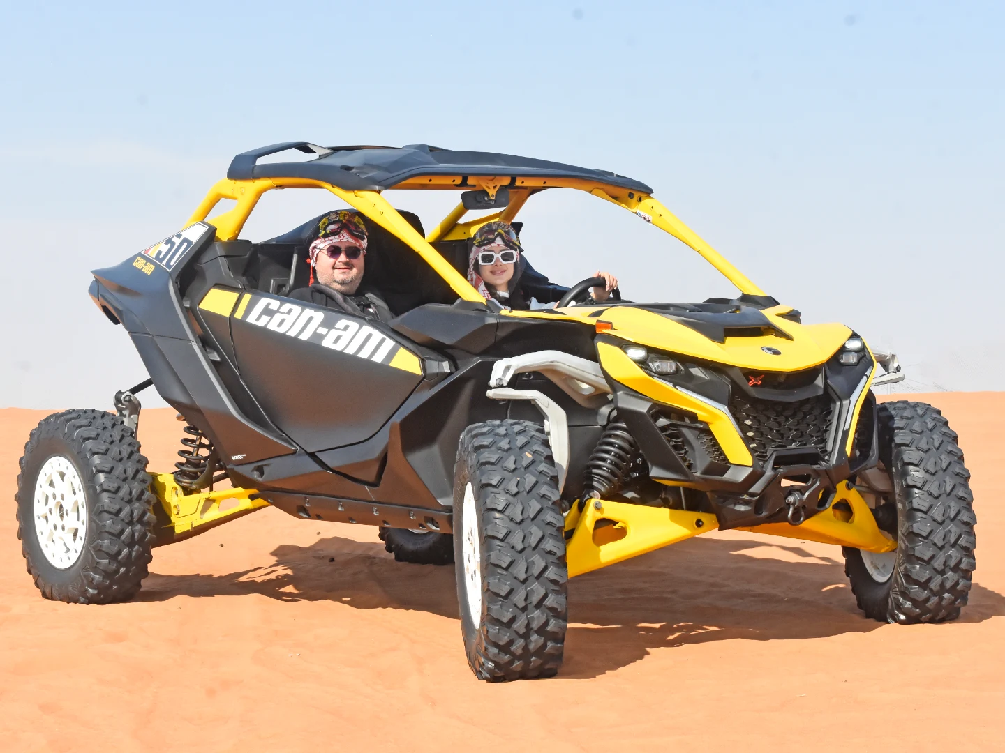 Can-Am Maverick R conquering Dubai red sand dunes during an offroad desert adventure with Offroad Rental Hub