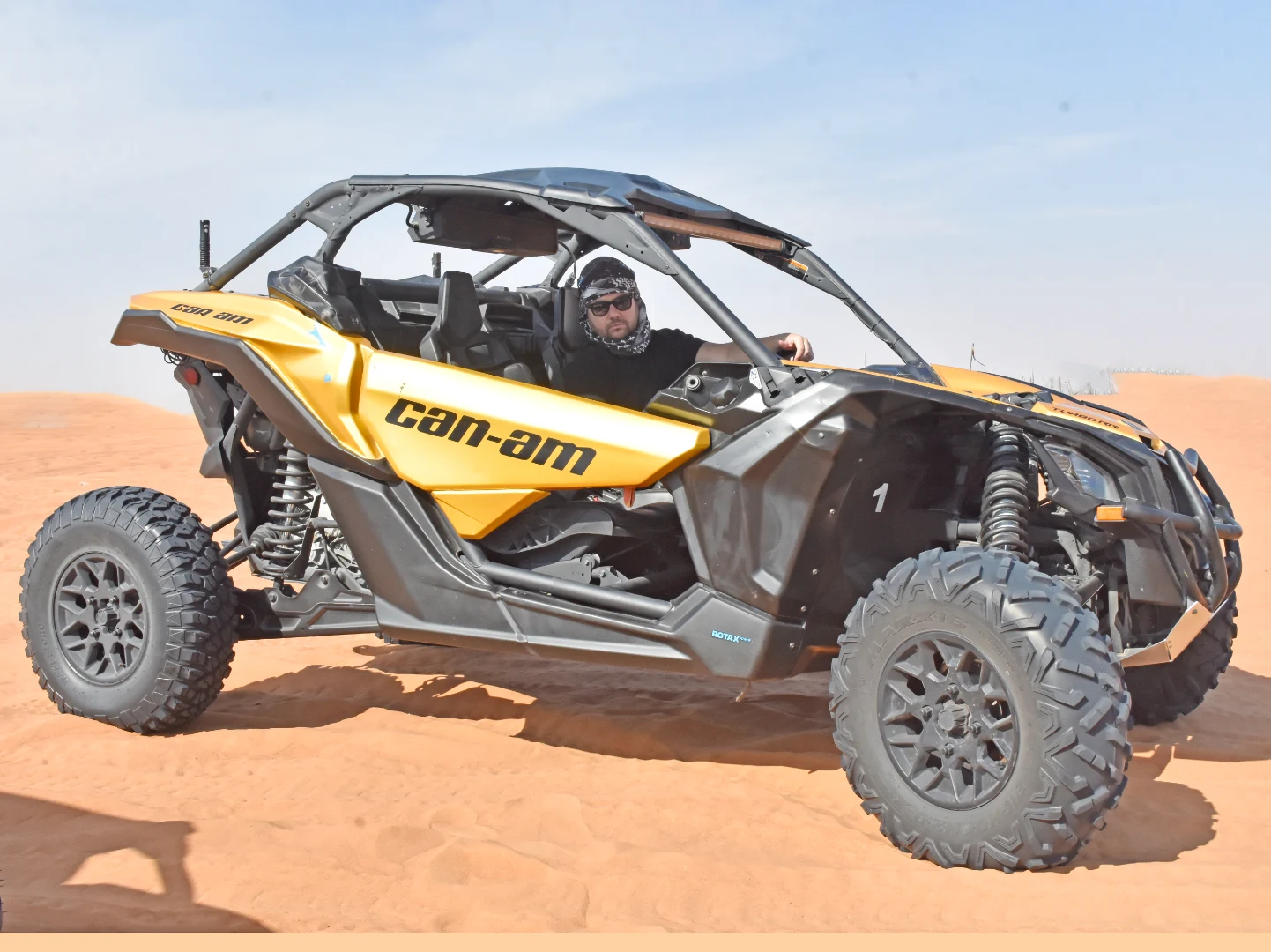 Can-Am maverick and Polaris RZR adventure across Dubai red sand desert.