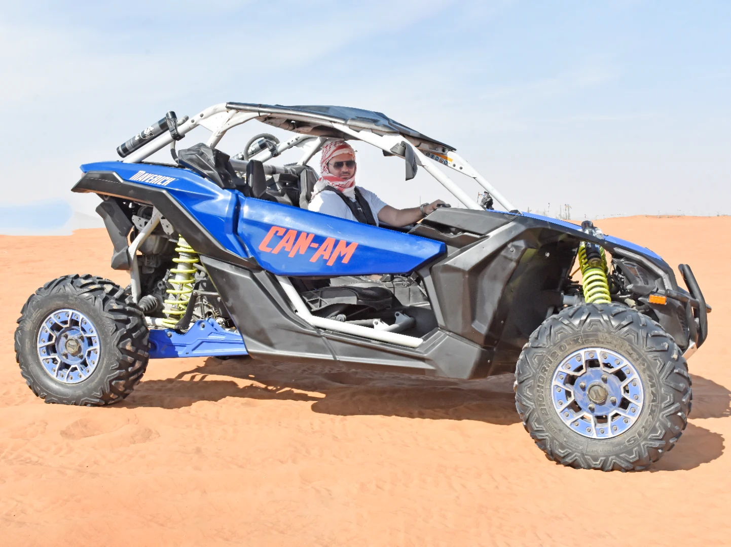 Can-Am maverick and Polaris RZR adventure across Dubai red sand desert.