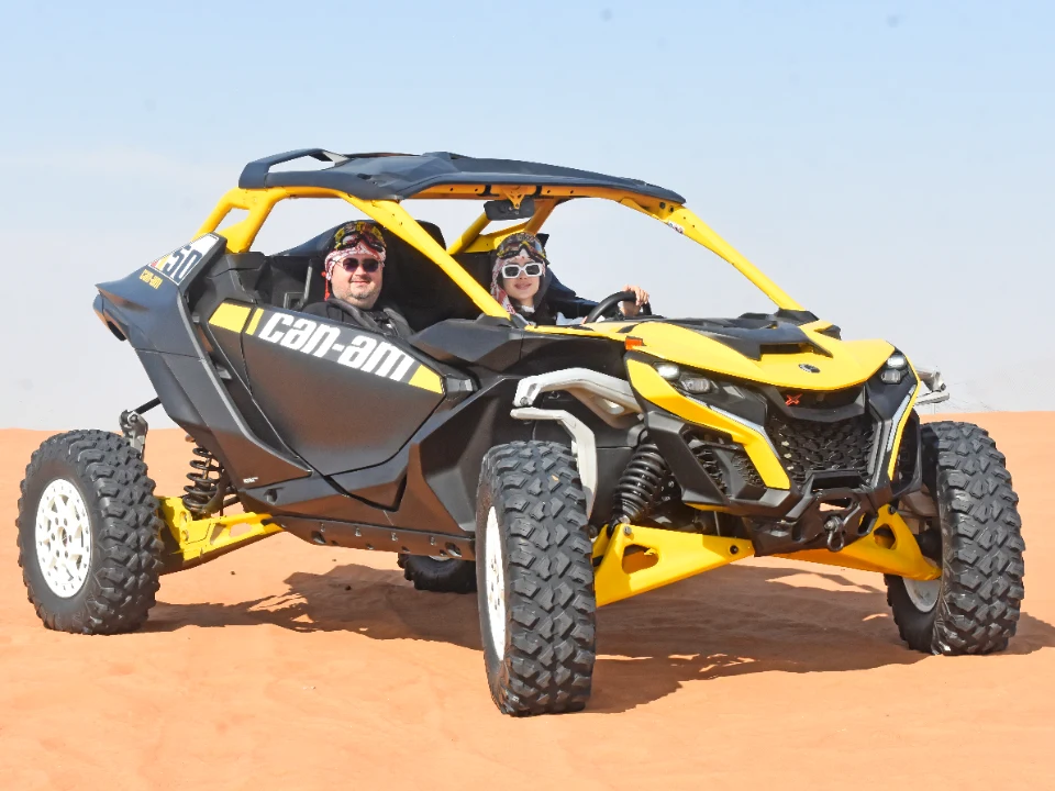 Can-Am Maverick R conquering Dubai red sand dunes during an offroad desert adventure with Offroad Rental Hub