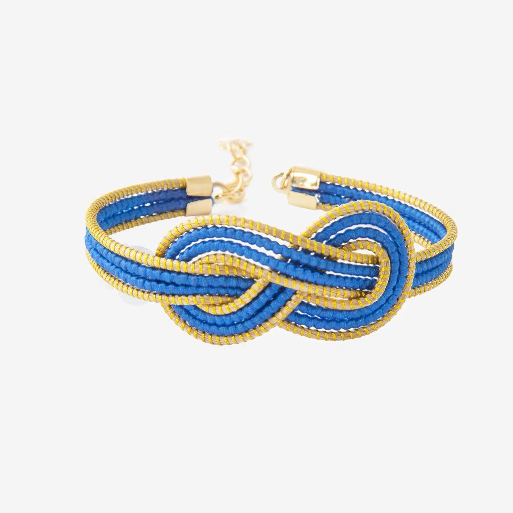 Uriel Bracelet Blu — gioiello in erba d'oro disegnato da Orit, intrecciato a mano nel Cerrado, Oroboros