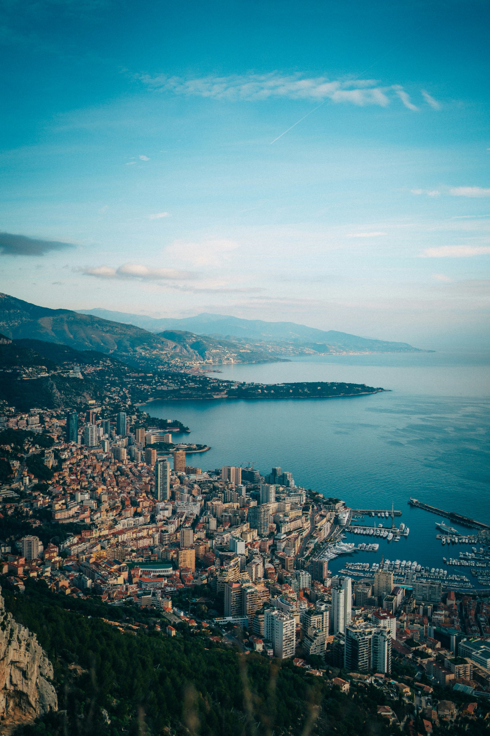 Row image, caption "02 Monaco": black-and-white aerial view of Monaco harbour and the coastline, ideally with a helicopt