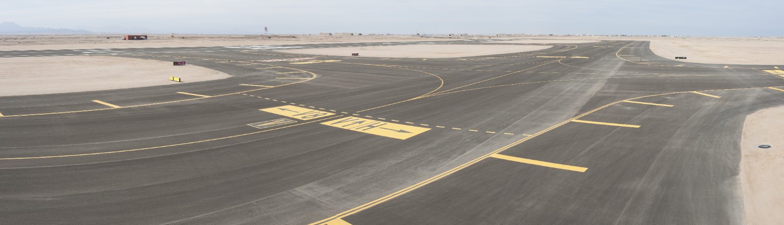 Empty airport taxiway and apron in daylight