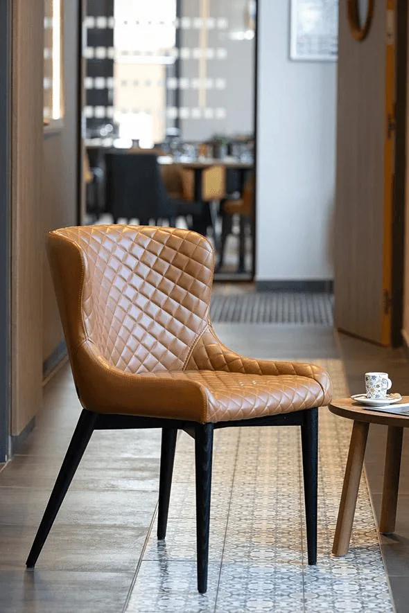 Chair Mils in a reference hospitality setting