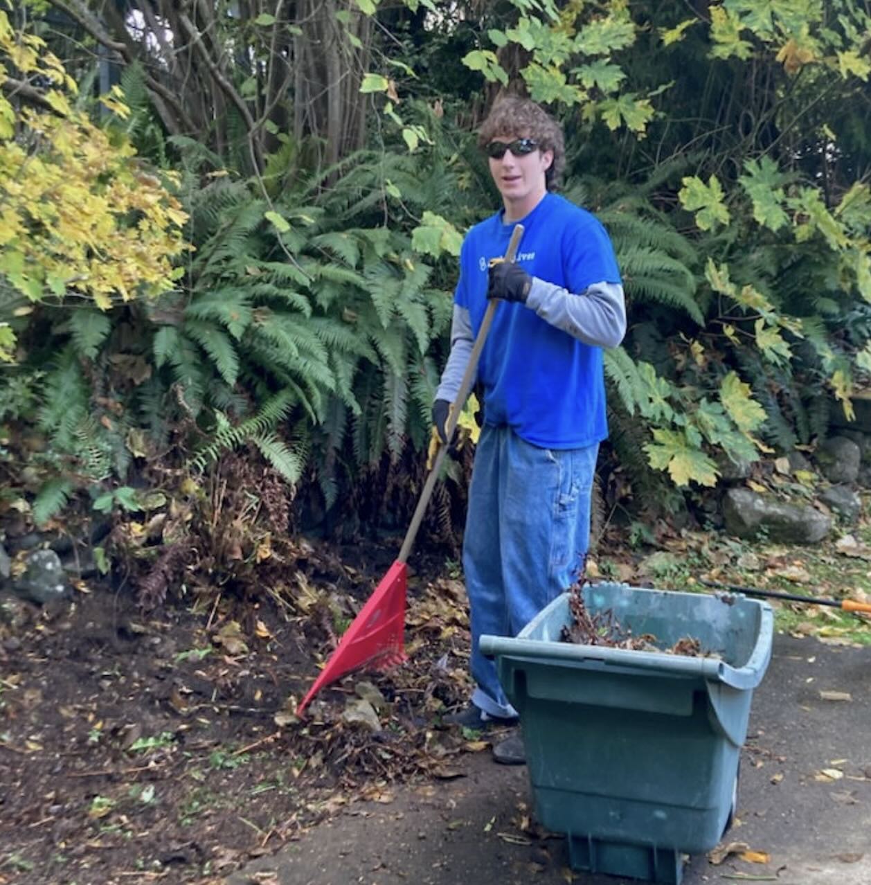 Linked Lives helper completing seasonal outdoor tasks for a senior