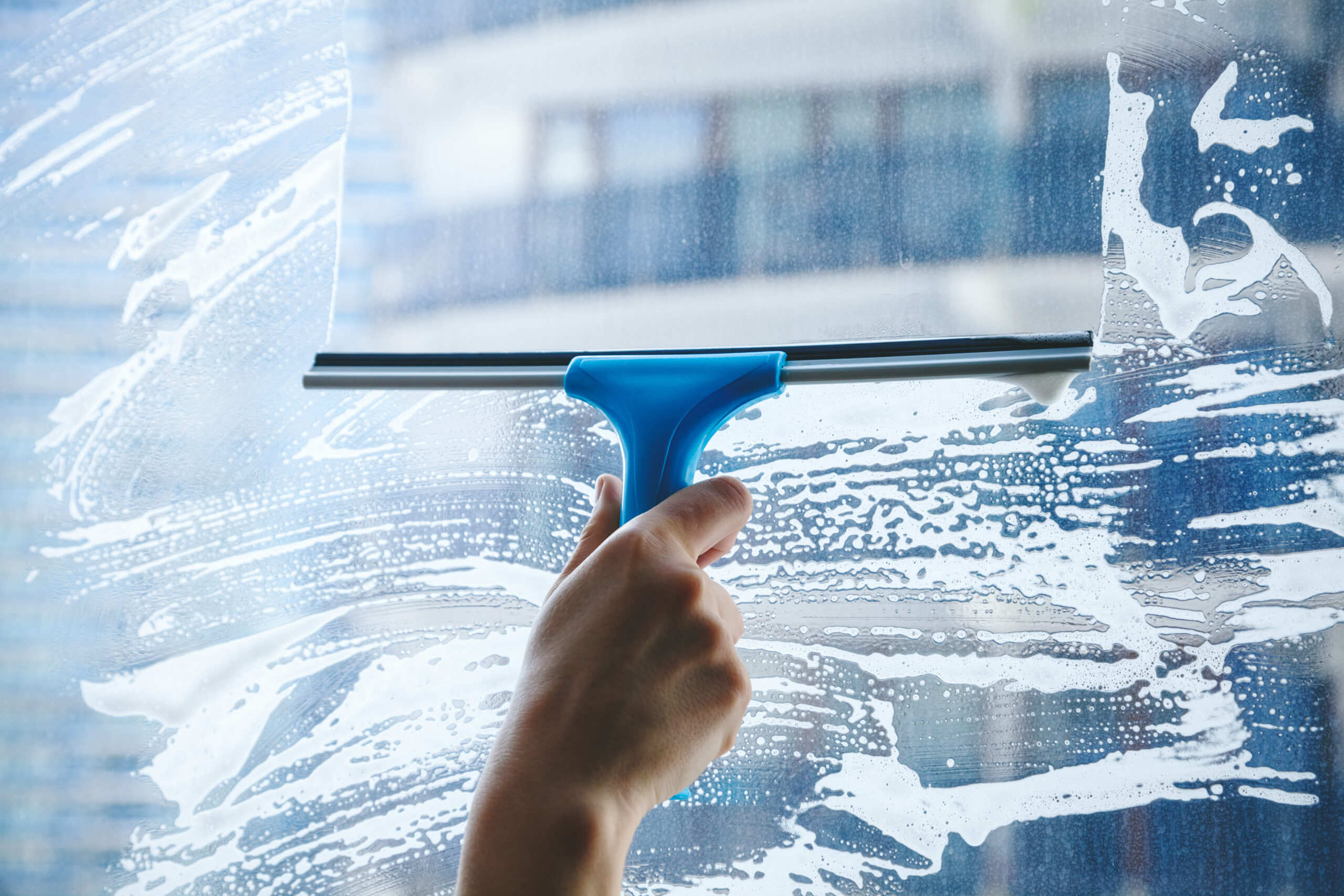 Squeegee on the window with our soap product.