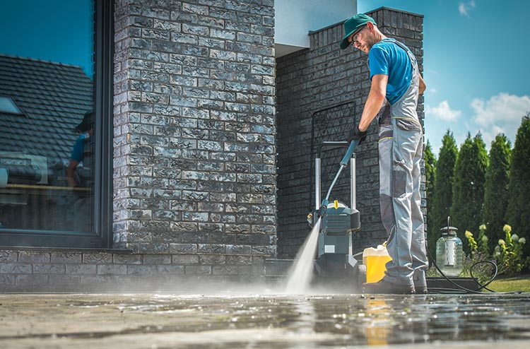 Pressure washing on the driveway