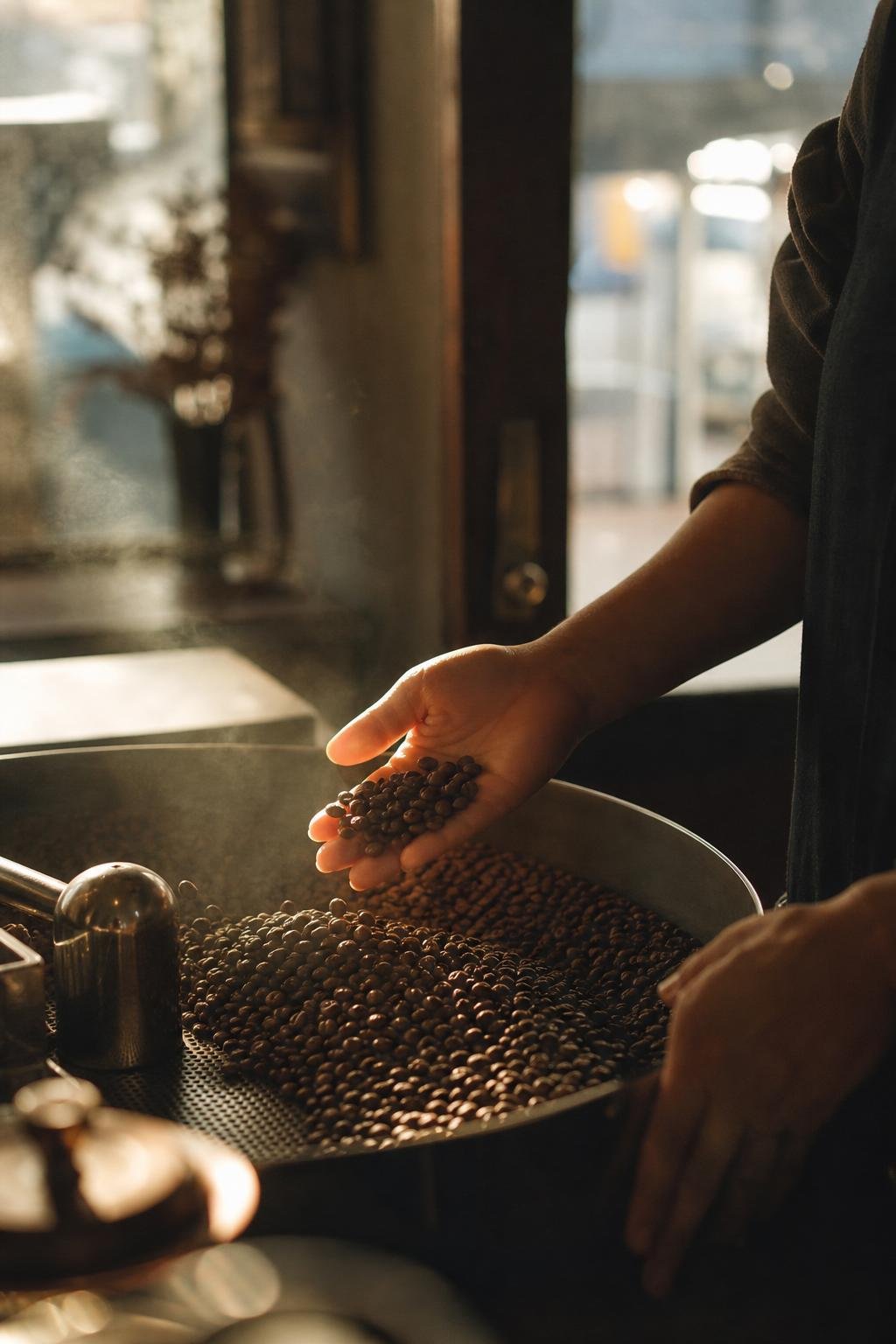Freshly roasted beans being scooped up by hand