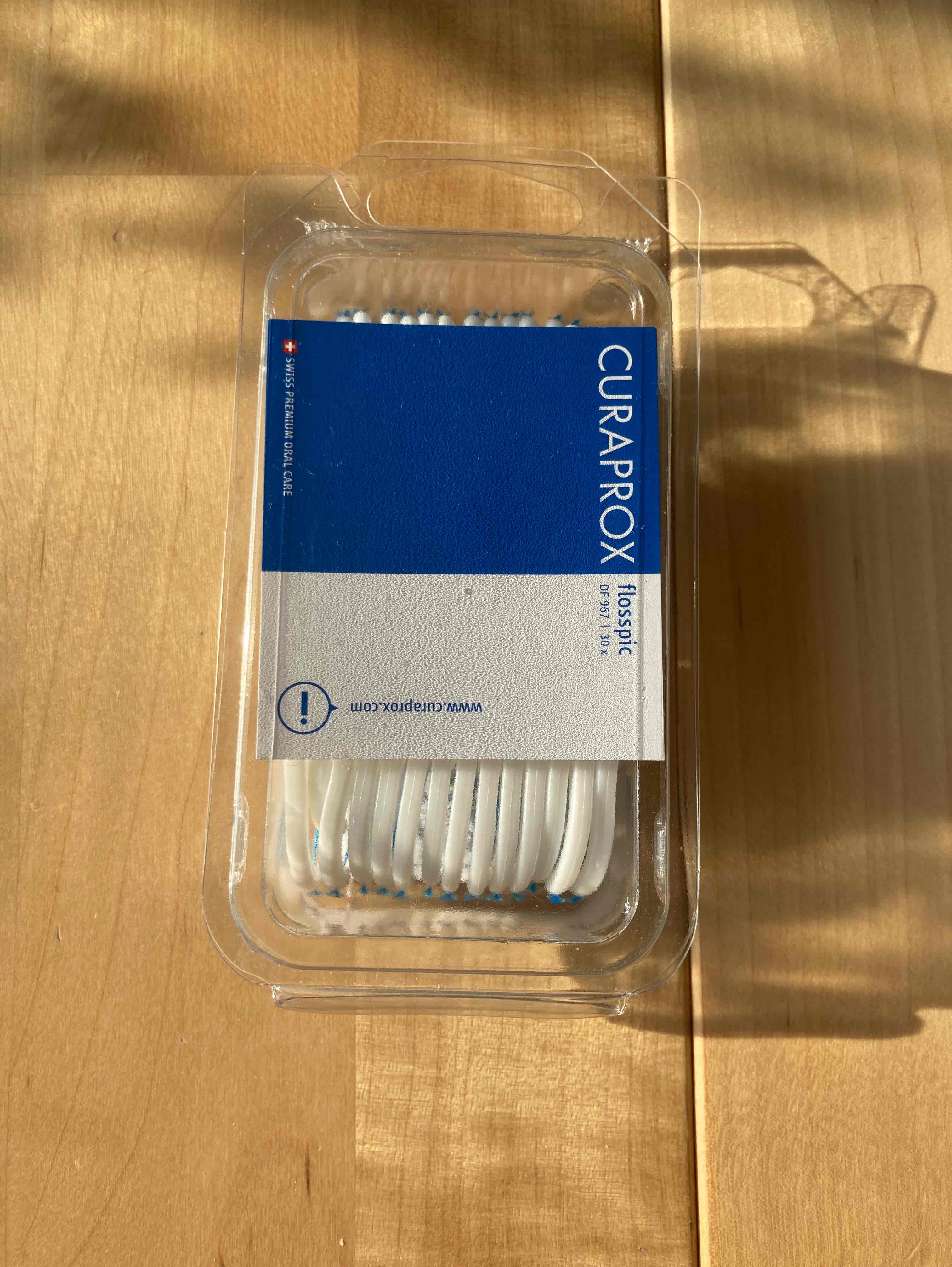 Dental floss mounted on toothpick