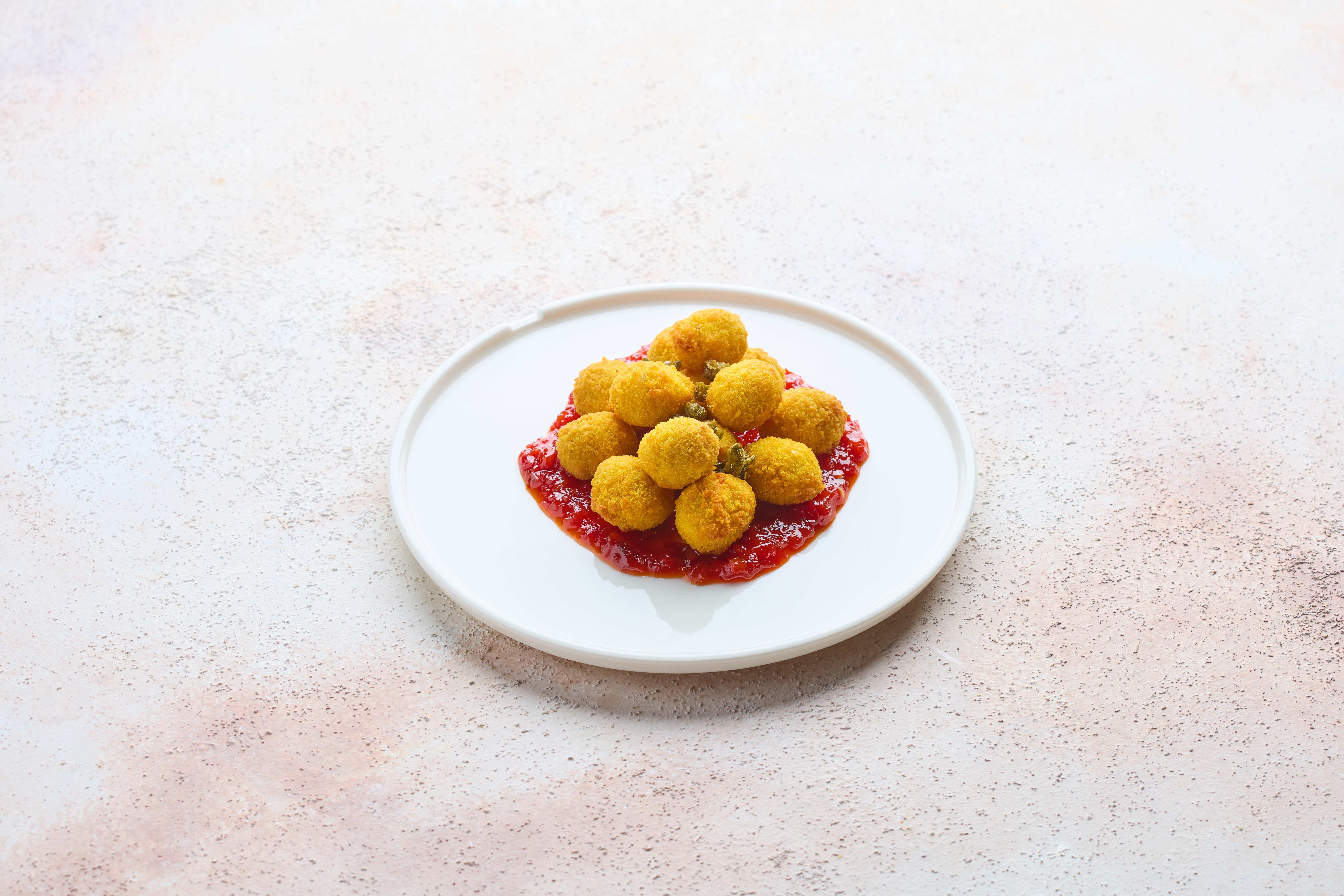 Breaded olives with spicy jam sauce