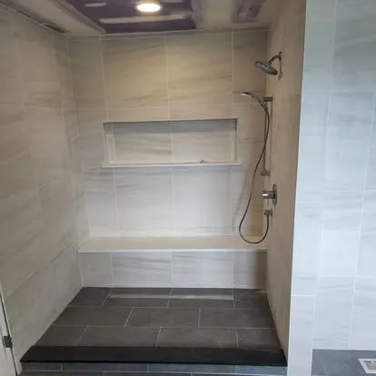 Gray tile bathroom with freestanding tub: Parisi Home Improvement bathroom project, photo 4
