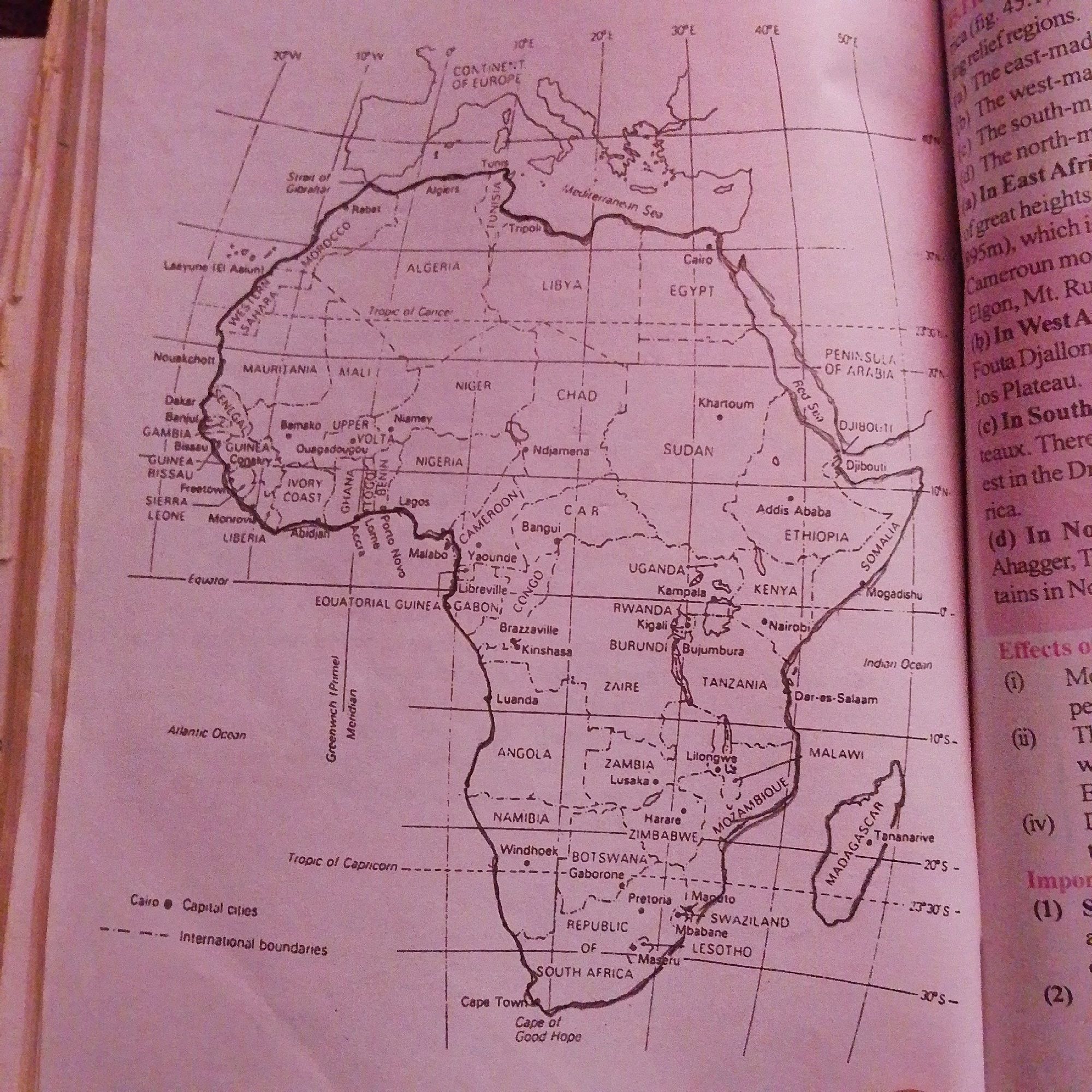 The image is a map of Africa, showing countries, capital cities, and geographical features like the Strait of Gibraltar, Mediterranean Sea, Tropic of Cancer, Equator, Tropic of Capricorn, Red Sea, Atlantic Ocean, and Indian Ocean. The map also indicates the Greenwich Meridian. A legend at the bottom left clarifies that a black dot represents a capital city and dashed lines represent international boundaries.
The city of Jalingo, Nigeria, is not depicted on this map of Africa.