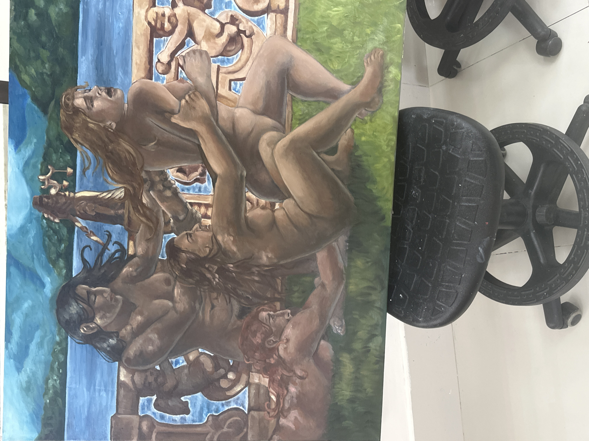 A painting with three nude figures is visible in the image. The painting also depicts a blue waterfall and a green lawn. To the right of the painting is a black stool. The location of the image cannot be determined as San Andrés Cholula, Mexico is not included in the image itself.