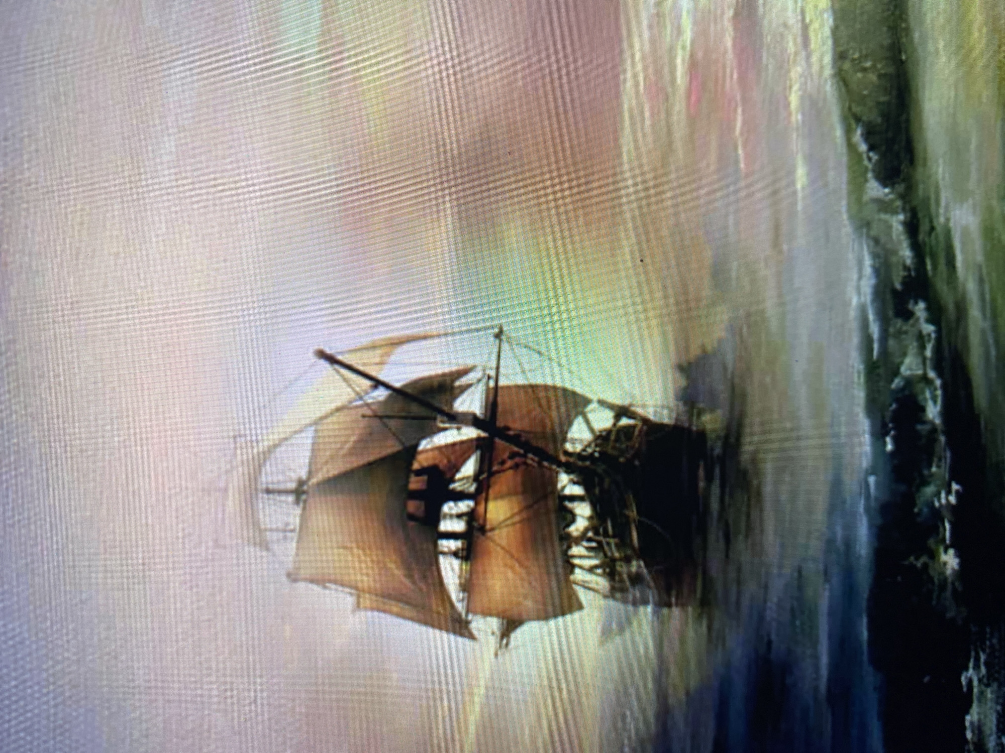 A painting depicts a large, multi-masted sailing ship with full sails, navigating through choppy water under a hazy, multicolored sky. The ship is positioned in the center-left of the frame, appearing to move towards the right. The water in the foreground is dark and turbulent with visible waves, while the water behind the ship is lighter and more diffused. The sky displays a gradient of soft colors, including pink, purple, yellow, and green, suggesting either sunrise or sunset. The scene is rendered in a style that appears painterly, with visible brushstrokes and a somewhat impressionistic quality. No people are discernible on the ship or in the surrounding environment. The location is not specified.