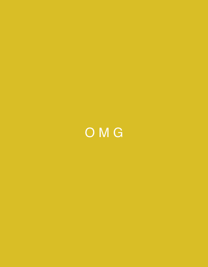 The image is a simple, centered text graphic against a solid mustard yellow background. The text "OMG" is displayed in white, sans-serif capital letters. There are no people, objects, or a discernible scene or setting. The graphic is static, with no activity or event taking place. There are no details regarding time of day, weather, or location cues. The only visible text is "OMG".