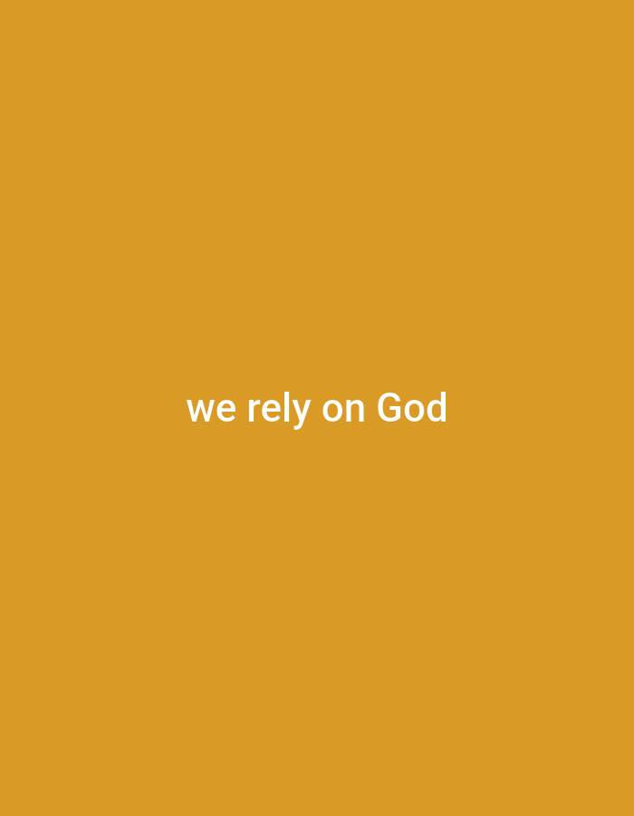 The image shows the text "we rely on God" in white font against an orange background. There are no people, objects, actions, interactions, or environmental details present in the image that would allow for its location to be determined in Gboko, Nigeria or anywhere else. The image is purely typographic.
