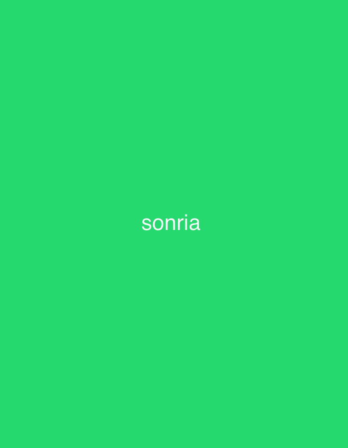 The image features a solid, bright green background. Centered horizontally and vertically on this monochromatic field is the word "sonria" (Spanish for "smile"), rendered in white, lowercase letters. No people, objects, or environmental details are visible in the image. The scene consists entirely of text on a plain colored background. The provided context suggests a potential location in Santa Ana, Venezuela, although there are no visual elements within the image itself to confirm or elaborate on this geographical detail.