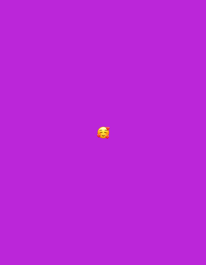 The image is a digitally rendered graphic with a plain purple background. In the center of the image, a yellow emoji with closed eyes and a smiling mouth is depicted. Two red hearts are floating near its cheeks, suggesting an expression of love or affection. There is no discernible location in Moscow, Russia, or any other real-world environment. The image appears to be a standalone digital graphic.
