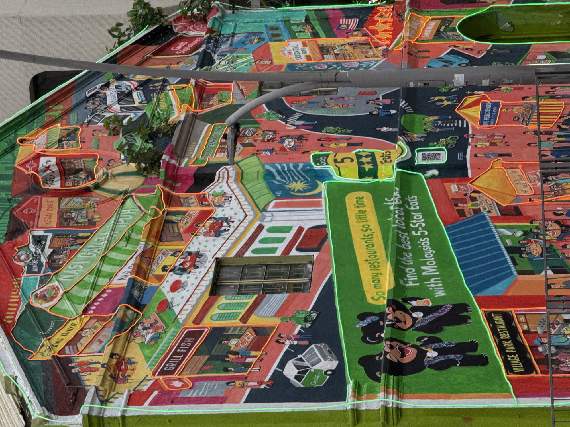 The image captures a section of a vibrantly painted rooftop in Kuala Lumpur, Malaysia. The roof displays a collage of scenes and advertisements, including depictions of local food establishments like "Nasi Ganeja," "King Kunyit," and "Grill Fish." The illustrations feature people engaging in daily life, like dining and commuting, with elements of Malaysian culture interspersed. Advertisements for "Grab Eats" and "Village Park Restaurant" are visible. There are hints of greenery, suggesting plants or trees nearby, and a metal bar runs across the top. The overall impression is a representation of Kuala Lumpur's vibrant and diverse food scene.