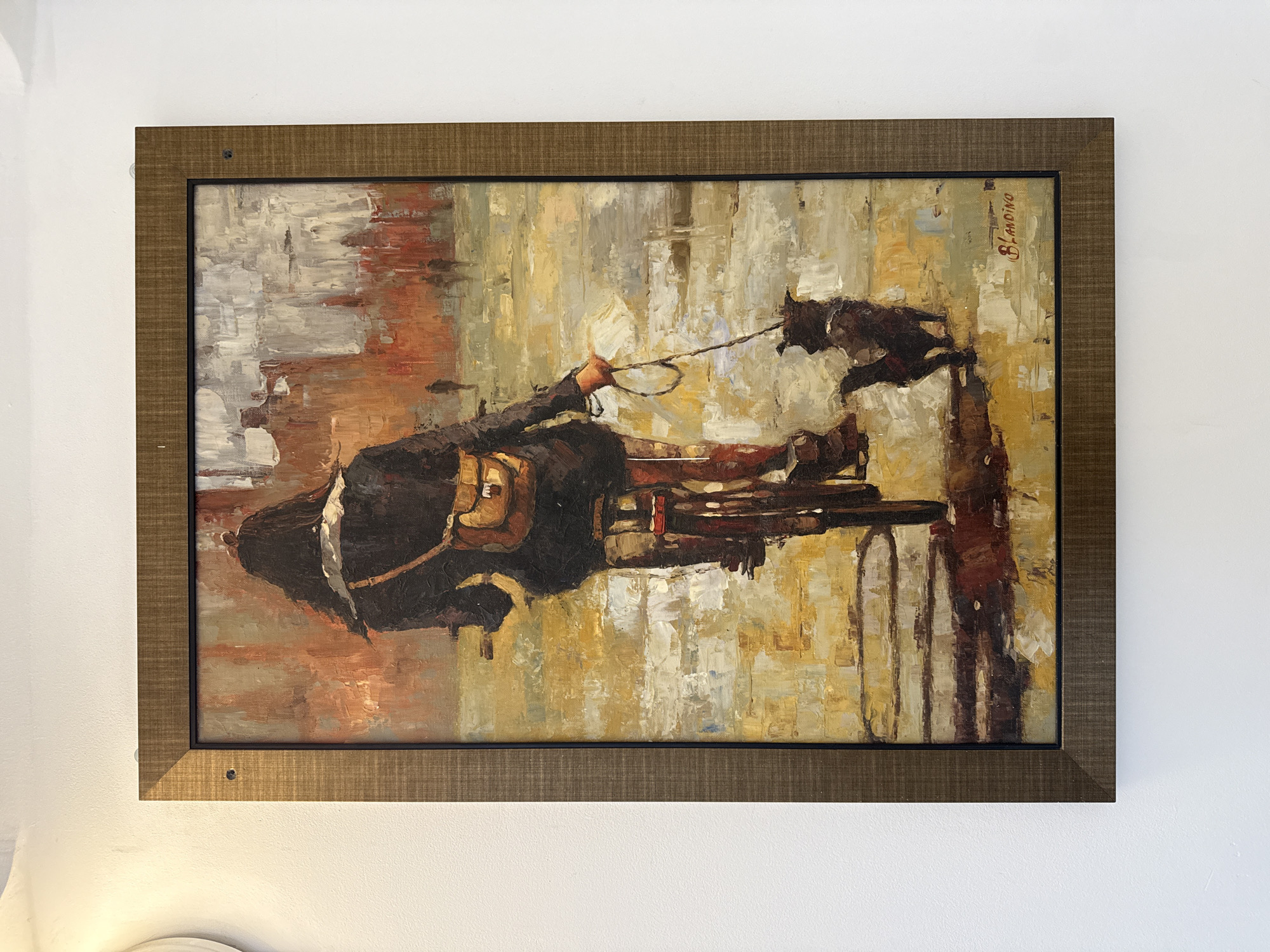 The image shows a framed oil painting hanging on a white wall. The painting depicts a figure in dark clothing, possibly a man in a carriage, with a dog leaping in front. The color palette is muted, with browns, yellows, reds, and grays. The painting is signed "Blandino" in the upper right corner. There are no visible signs that this location is in Izhevsk, Russia.