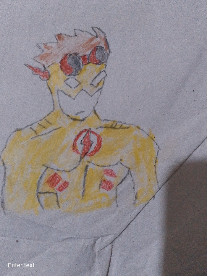 A drawing depicts a character resembling a superhero, possibly a version of The Flash or a similar speedster character. The character is primarily colored yellow, with red accents. They are wearing goggles and have stylized hair. A lightning bolt emblem is present on their chest. The drawing is on a piece of paper with some creasing visible in the lower portion of the image. The background is plain. The location appears to be on a piece of paper on a table.