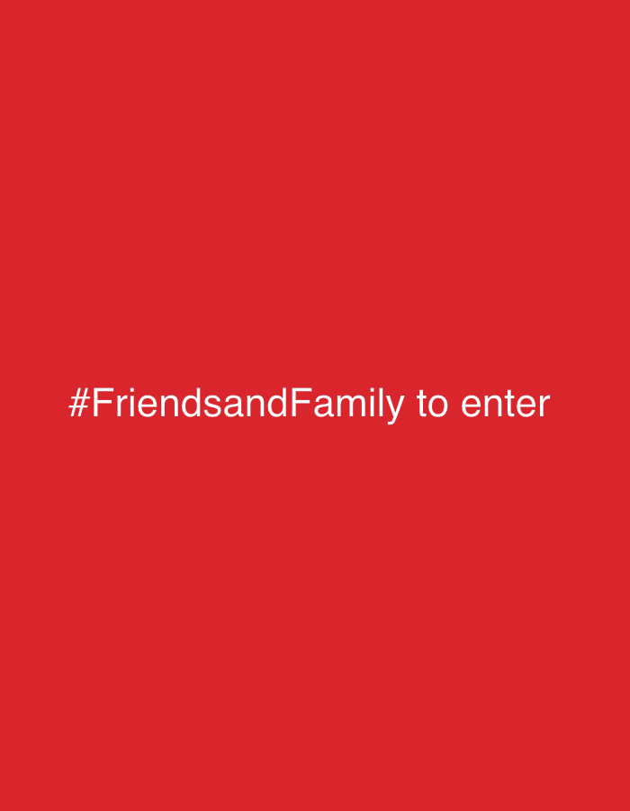 A red background with the white text "#FriendsandFamily to enter" in the center. The location is not discernible from the image.