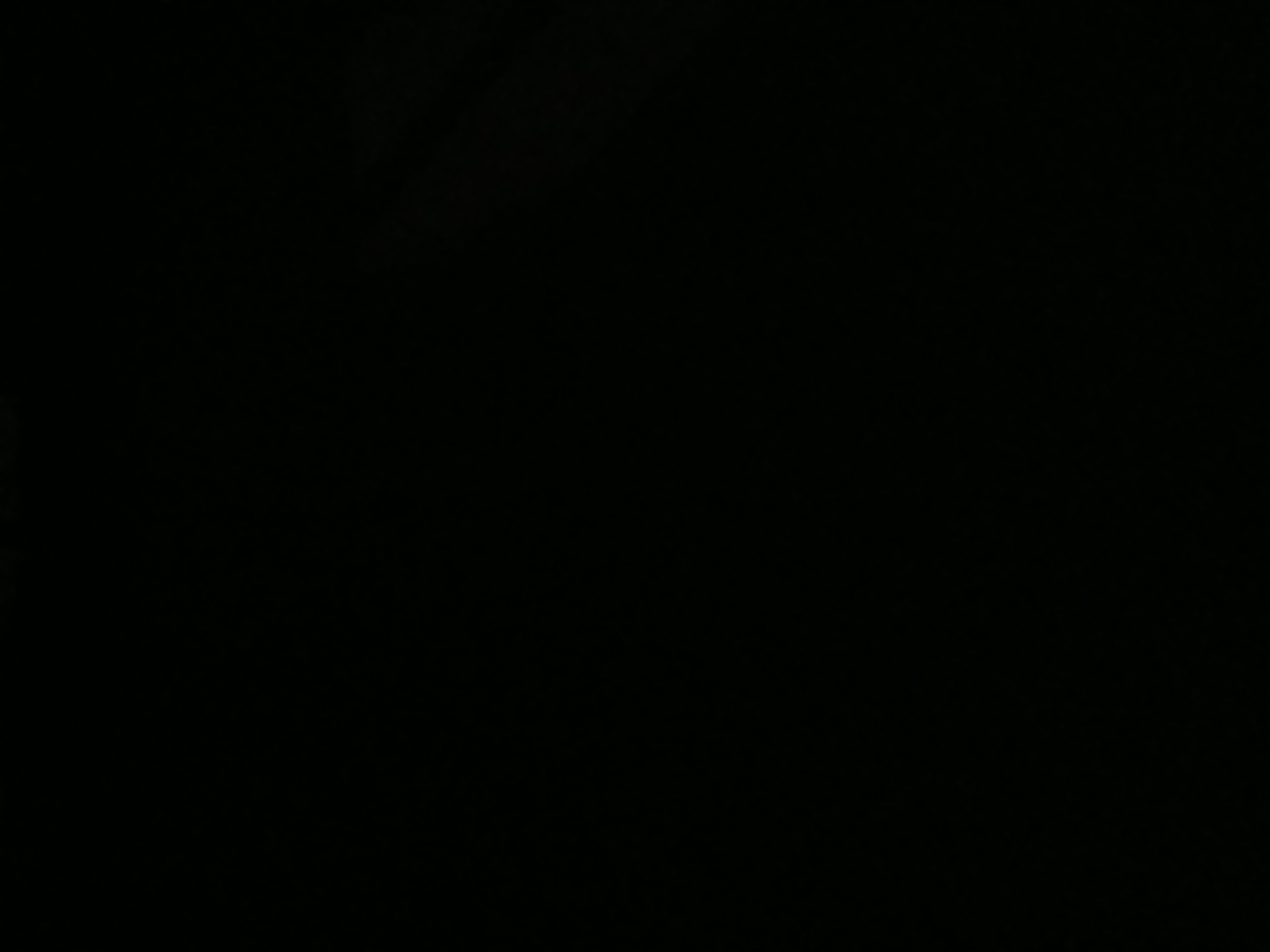 The image is completely black, making it impossible to discern any details about the scene or its location in Tenggarang, Indonesia, or any other subject matter.