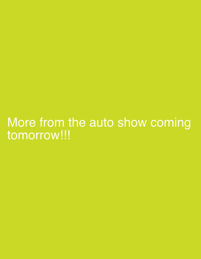 The image is a solid chartreuse green color with the text "More from the auto show coming tomorrow!!!" in white text located towards the bottom center of the image. There are no specific people, subjects, objects, actions, interactions, or environmental details visible in the image to suggest a location, including in the city of New York, United States of America.