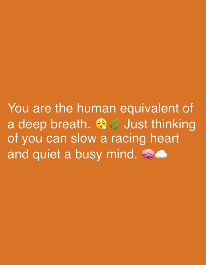 The image contains text overlayed on an orange background. The text reads: "You are the human equivalent of a deep breath. 😮💨🌿 Just thinking of you can slow a racing heart and quiet a busy mind. 🧠☁️" The image is a screenshot or digital graphic, not a photograph of a physical scene. Therefore, there is no location in Sergeevo, Russia, or any people, subjects, objects, or actions to describe.