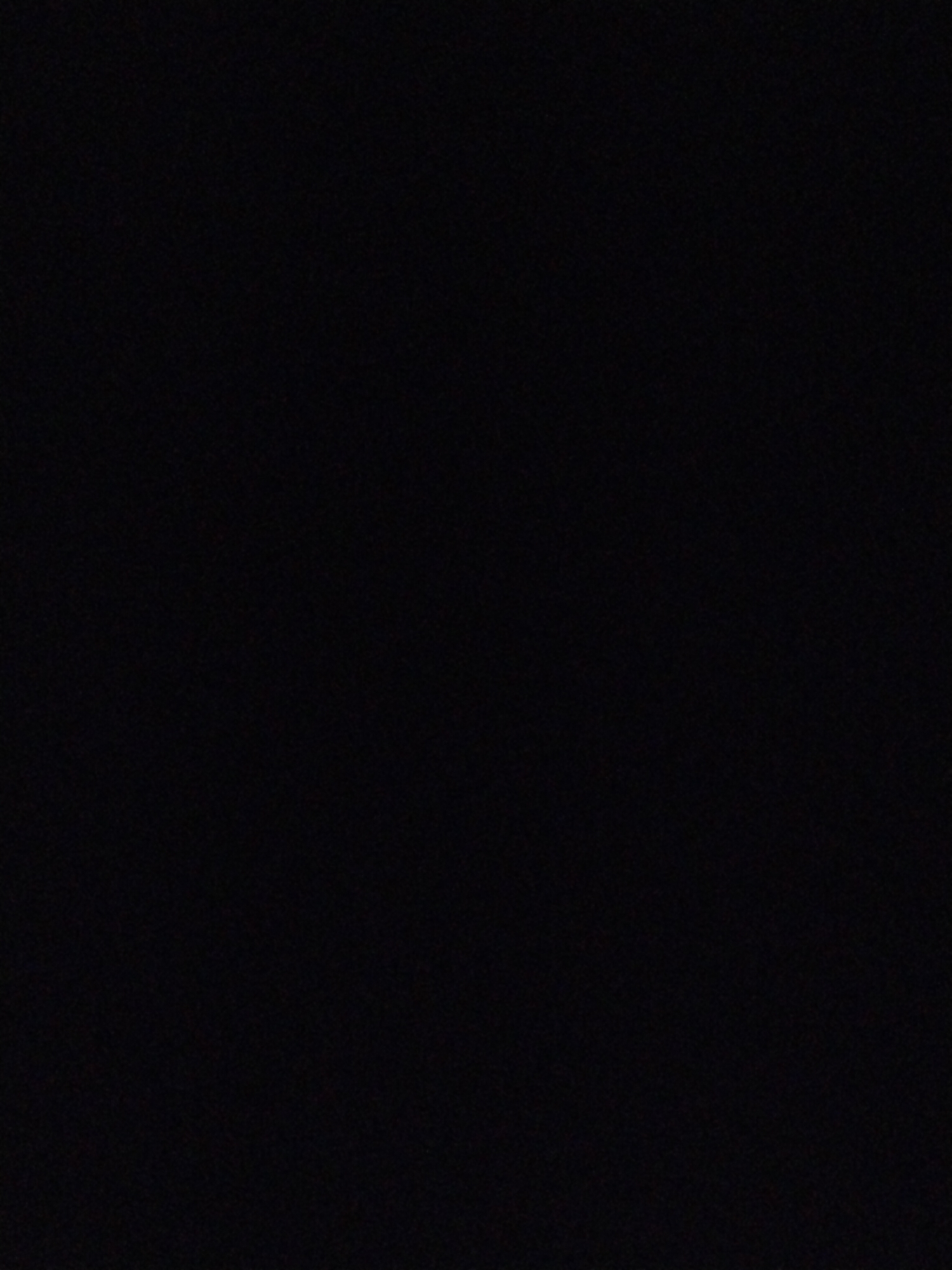 The image is completely black, providing no visible details about a scene, location, subjects, or objects. It is impossible to determine anything about the city, people, actions, or environment.